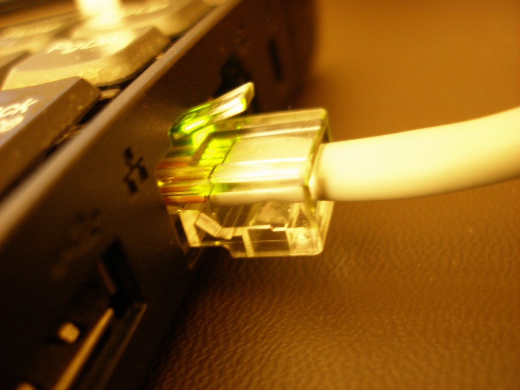 Ethernet cable connected to an illuminated network socket